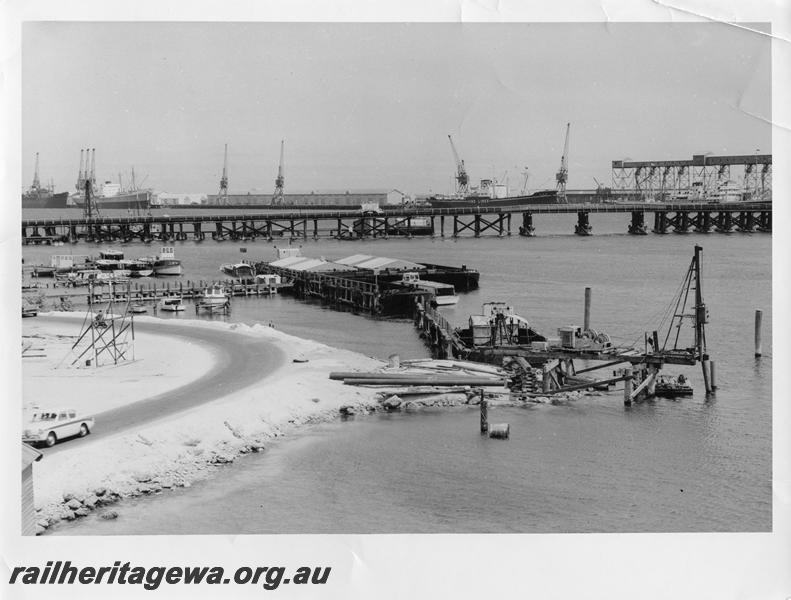 P00057
20 of 98 images showing views and aspects of the construction of the steel girder bridge with concrete pylons across the Swan River at North Fremantle.
