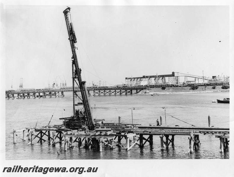 P00063
26 of 98 images showing views and aspects of the construction of the steel girder bridge with concrete pylons across the Swan River at North Fremantle.
