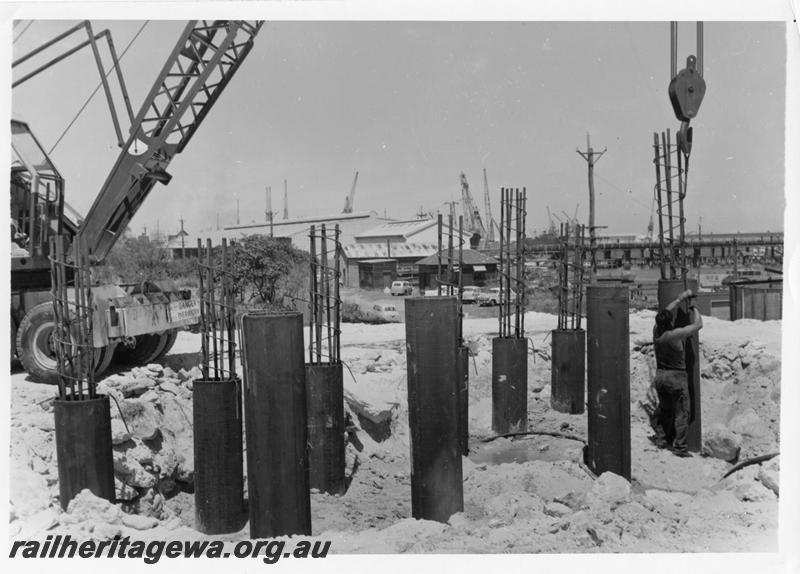 P00099
62 of 98 images showing views and aspects of the construction of the steel girder bridge with concrete pylons across the Swan River at North Fremantle.
