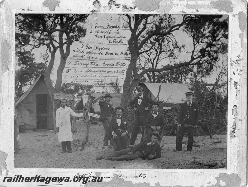 P00143
Station staff, Bayswater, photographed in front of the station premises consisting of tents. The names and roles of the staff are written on the photograph which includes the Station Master, Tom Foody. c1897
