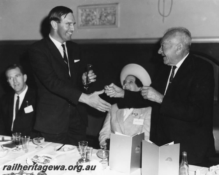 P00350
Ceremony for the opening of the Standard Gauge project, Kalgoorlie, the Federal Minister for Transport, Mr. I. Sinclair making an award
