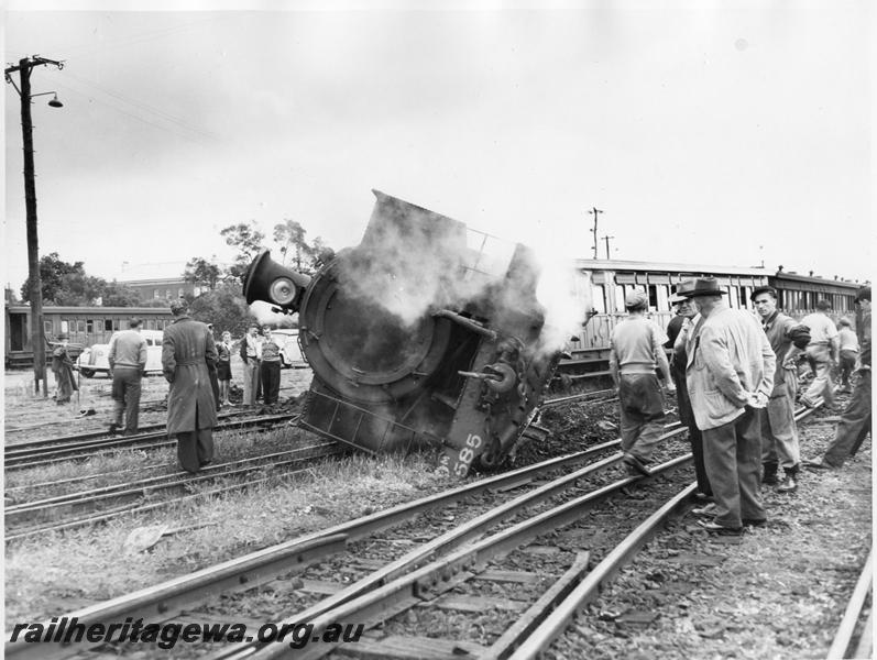 P00443
1 of 4 views of DM class 585 on No. 195 Passenger derailed and lying on its side, Midland Junction, front on view, date of  derailment 30//7/1953
