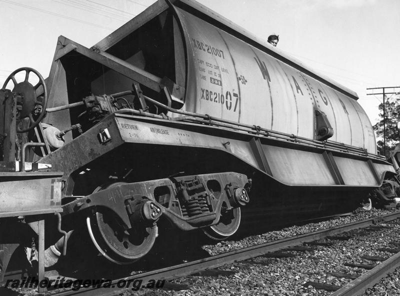P00448
2 of 4 views of the derailment of a bauxite train at Mundijong, XBC class 21007 bauxite hopper, derailed and on a lean, end and side view.

