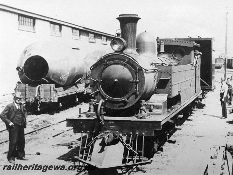 P00754
N class steam loco, oil headlight, bar cowcatcher, rerailing jacks on the running boards, heavy load for the South west, Perth goods Yard, front and side view
