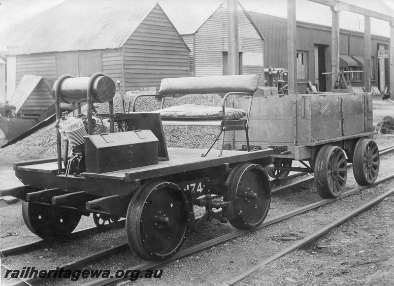 P01004
Motorized ganger's trolley with full width bench seat hauling a box trailer, front and side view.
