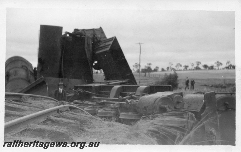 P01018
F class on No. 105 Mixed Goods derailed and lying on its side, derailed wagons piled up behind, Dumberning, BN line. Date of derailment 14/3/1934
