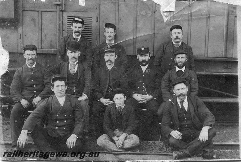 P01048
Station staff group photo posed in front of vehicle No. 145.
