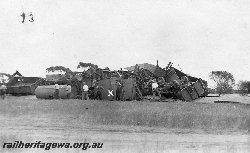 P01075
3 of 3 views of the derailment at the 51 mile point, NR line, 2nd March 1932, showing derailed wagons piled up across the track. Photo taken from the side of the cottage and looking slightly towards the rear of the train
