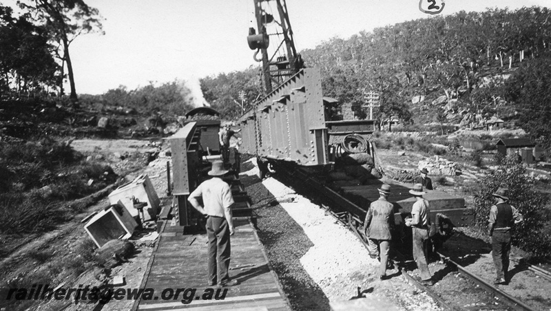 P01429
4 of 13 images of the construction of the duplicate steel girder bridge No.1 at 16 miles 25 chains on the ER through the John Forrest National Park, main girder being lifted into position

