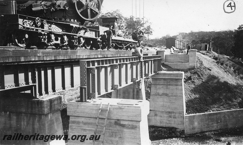P01431
6 of 13 images of the construction of the duplicate steel girder bridge No.1 at 16miles 25 chains on the ER through the John Forrest National Park, one of the main girders being placed on the piers
