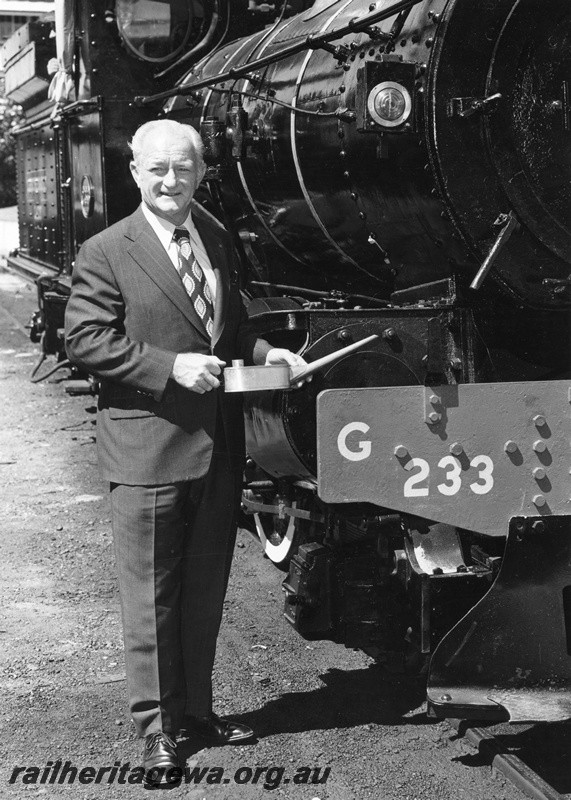 P01546
3 of 3 views of the Commissioner of Railways, Mr R Pascoe posing in front of G class 233, Perth, feigning oiling the loco
