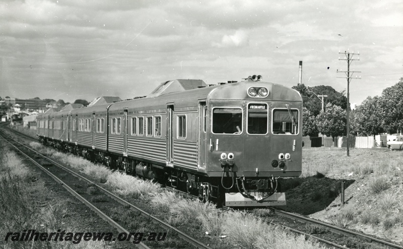 P01553
Four car ADK class railcar set when new, between Subiaco and Daglish, heading towards Fremantle, side and front view.
