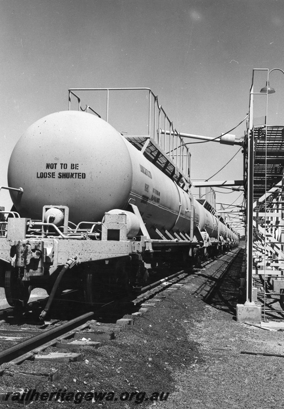 P01557
JK class caustic soda tanker, Pinjarra plant, being unloaded, end and side view.
