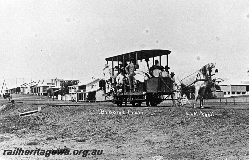 P01889
Horse drawn carriage on the Broome jetty tramway, view shows passengers on board the carriage.

