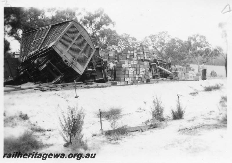 P02048
4 of 4 views of a derailment at the157-78 mile point on the Donnybrook to Katanning Railway, DK line, between Noggerup and Goonac, FD class van derailed and stacks of fruit boxes next to the track, date of derailment 26/3/1955

