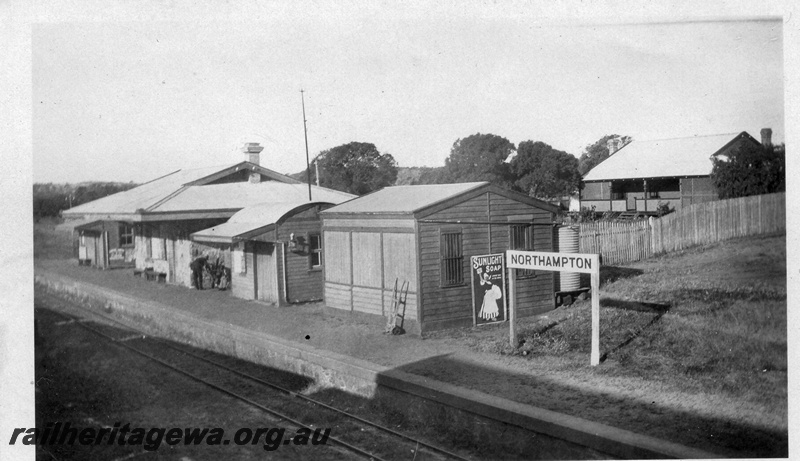 P02178
Station buildings, Northampton, GA line, maximum number of buildings, from right to left : the Refreshment Room, Shelter shed, Traffic Office, Ladies Waiting Room, Station Master's house in the background.

