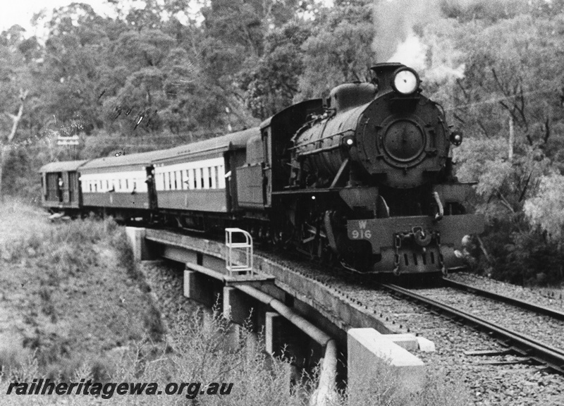 P02203
2 of 3 views of W class 916 on WA Division's Outing Committee Special (ARHS tour train) between Collis and Brunswick Junction, BN line, crossing a low bridge.
