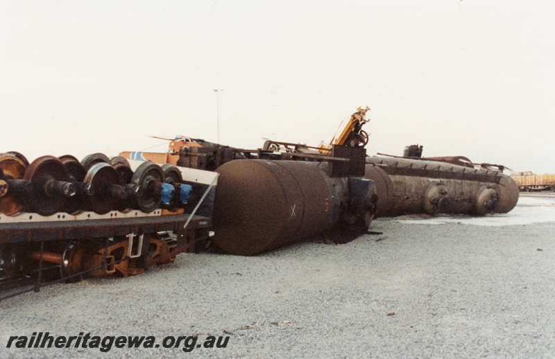 P02567
5 of 8, Derailment showing tankers on their side, and foam sprayed over spillage, Forrestfield marshalling yard.
