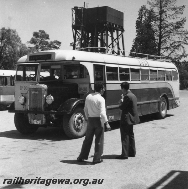 P02679
Railway Road Service bus Da30, Daimler, front and side view, water tower with 25,000 gallon cast iron water tank in the background.
