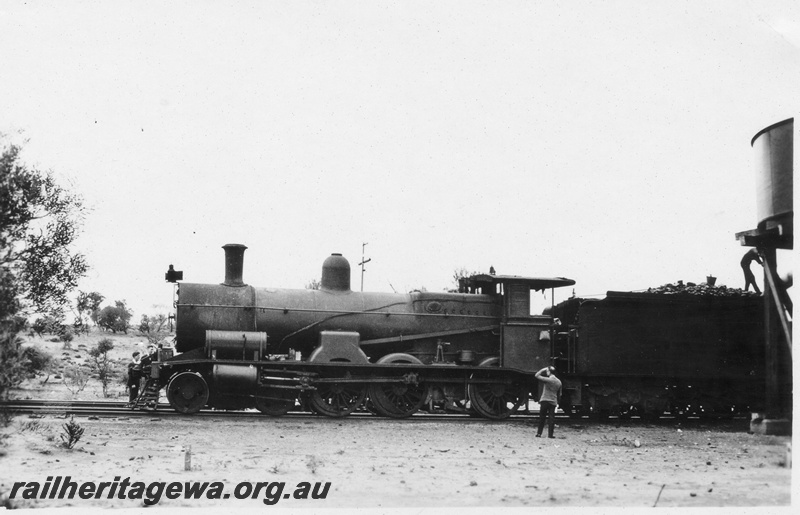 P02806
Commonwealth Railways (CR) G class loco, part of water tower, TAR line, side view

