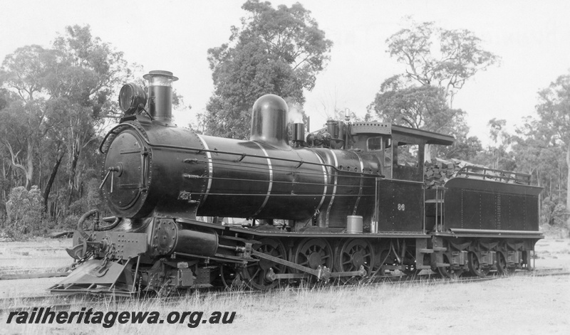 P02845
Bunnings YX class 86 steam locomotive with a load of wood in the tender, front and side view, Yornup.
