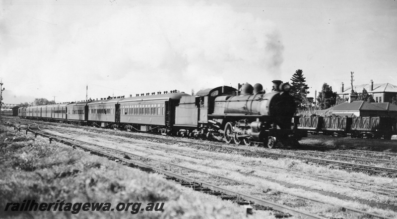P02851
P class steam locomotive leaving Midland bound for Perth on country passenger working, passenger carriages, side view, ER line, c1940.
