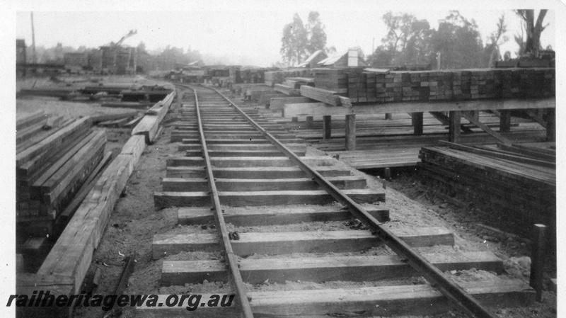 P02898
2 of 2, Yard at Bartons Mill, unballasted track, stacks of sawn timber, c1930.
