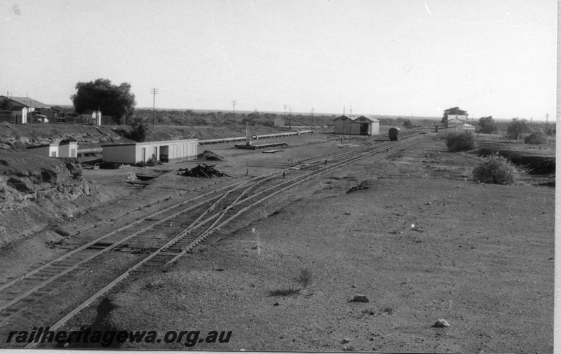 P02913
Coolgardie yard, goods shed, station building, loading platform and crane, sidings and tracks, EGR line, c1970.
