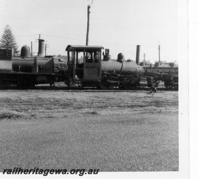 P03614
Millars Kia Ora steam locomotive and H class 18 steam locomotive, side view, stowed, Bunbury, SWR line.

