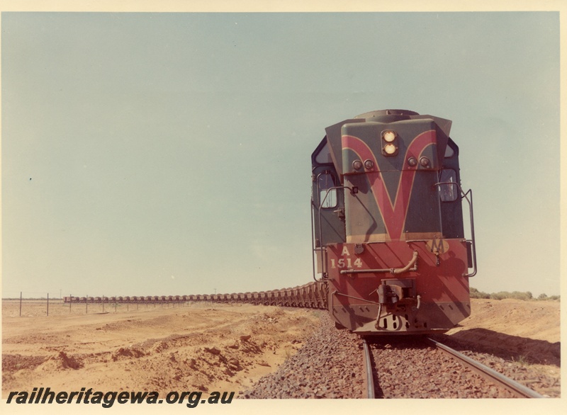 P03655
A class 1514, on iron ore train, Koolanooka Hills, EM line, side and front view, c1960

