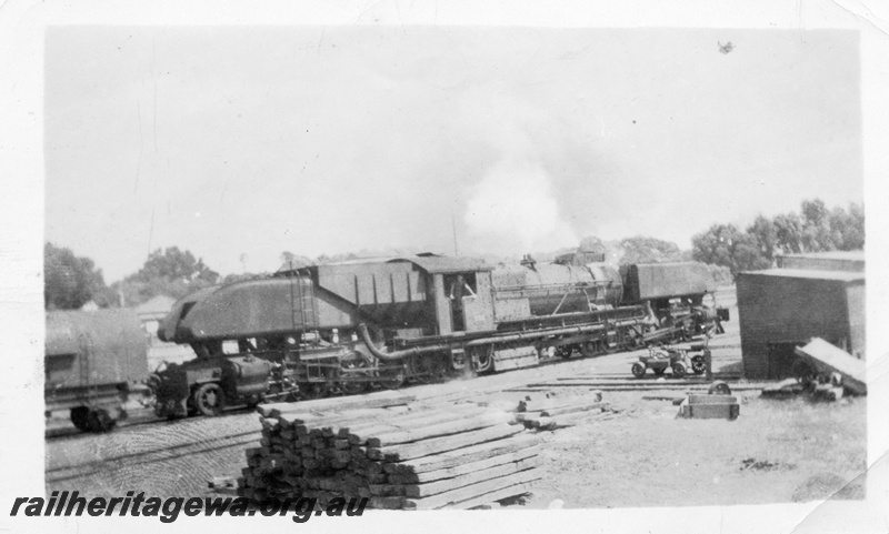P03696
ASG class as an oil burner, ganger's trolley, ganger's sheds, sleeper stacks, c1948-50, bunker end and side view
