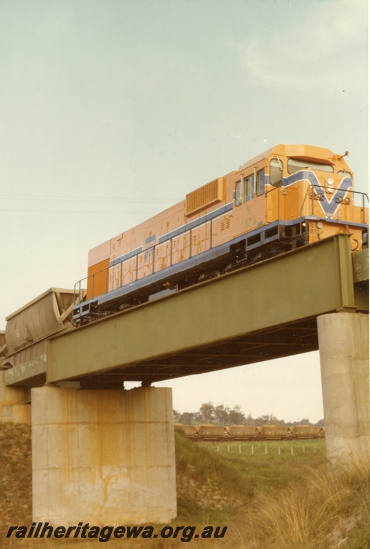 P03836
N class 1872, Westrail orange with blue and white stripe, on goods train, crossing concrete and steel bridge, Mundijong, SWR line. Same as P4195
