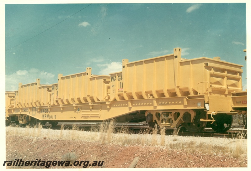 P03948
1 of 2, WFW class 30115 flat wagons, (later reclassified to WFDY), for iron ore containers, side and end view, in as new condition.
