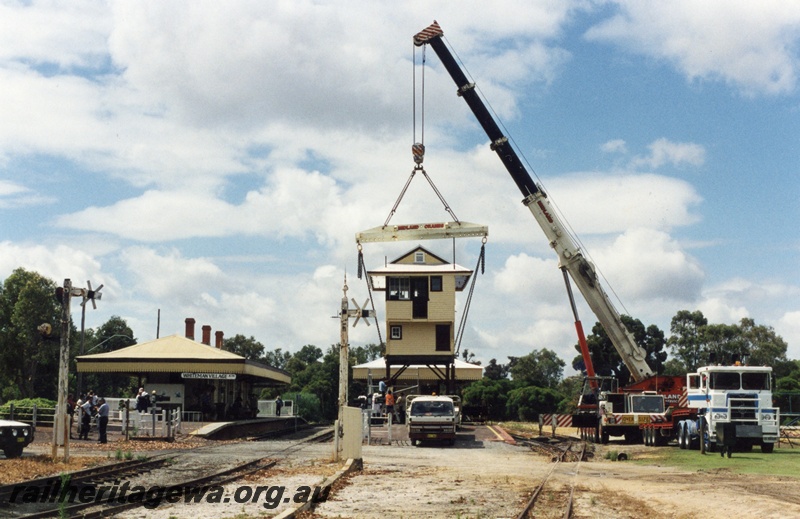 P04259
Ex Subiaco signal box, being lifted into position by crane, station buildings, semaphore signal, Whiteman Village Jctn station, Bennett Brook Railway
