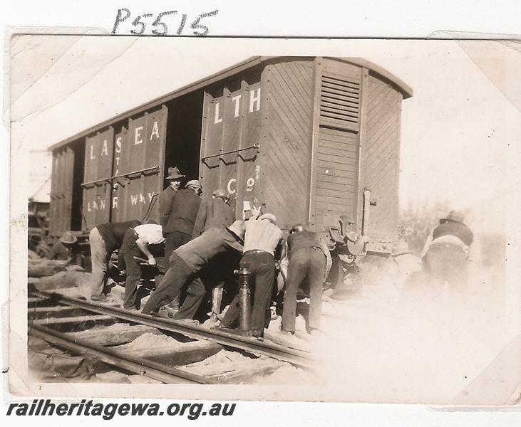 P05515
Derailment 144.25 mile, near Marchagee, MR line, workman pushing derailed MRWA LC class  bogie van,  date of derailment 20/6/1936
