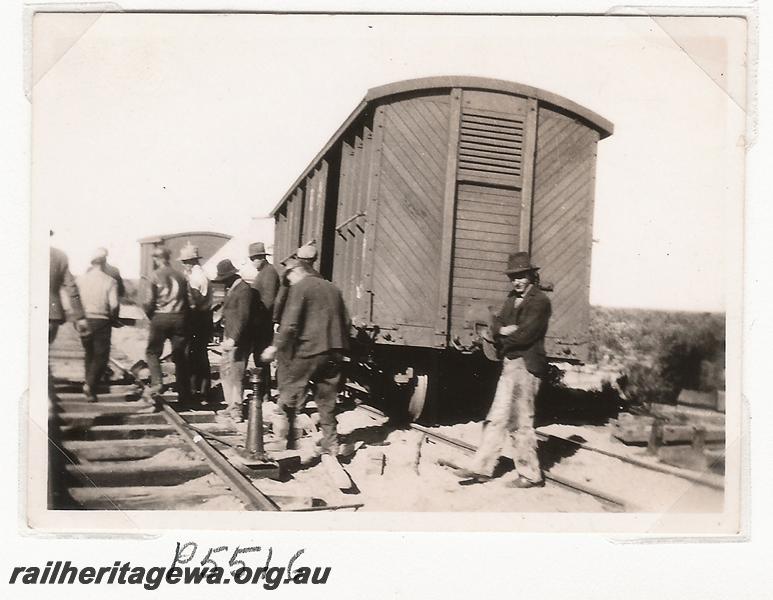 P05516
Derailment 144.25 mile, near Marchagee, MR line, workmen around derailed MRWA LC class bogie van,  date of derailment 20/6/1936
