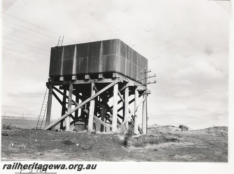 P05701
Water tower with a 25,000 gallon cast iron tank, telegraph pole, Grants, NR line
