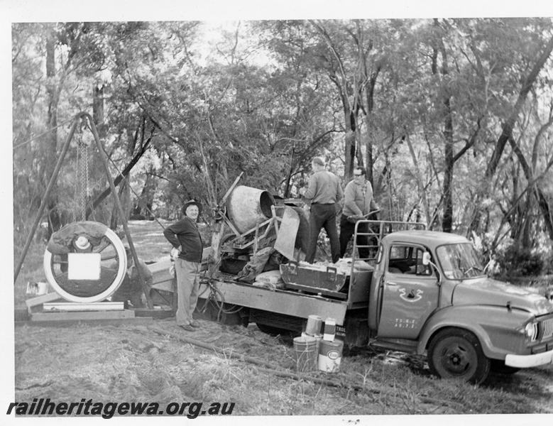 P05812
WAGR Railway Road Service truck with ARHS members on tray with cement mixer. Wonnerup Monument in view being installed
