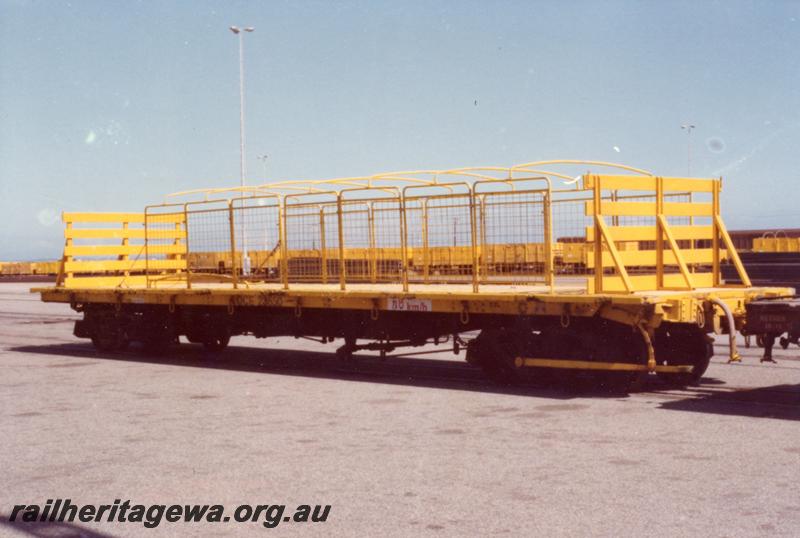 P06167
QCE class 23650, with bulkheads and wire cage sides, yellow livery, side and end view.

