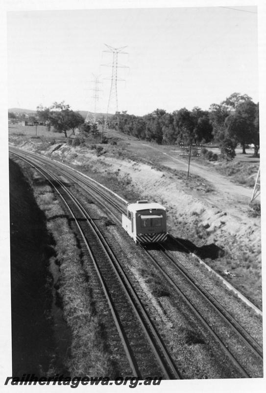 P06406
Standard Gauge Matisa Track Recorder Car, Bellevue, the formation of the abandoned narrow line can be seen to the right of the line, elevated view looking north.
