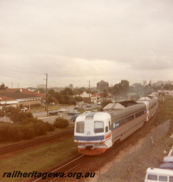 P06523
Prospector railcar set departing Perth Terminal, white front with blue horizontal strip livery

