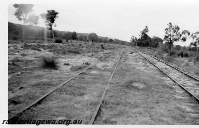 P06531
Track, halfway between Mundijong and South West Highway turnoff, shows old rails on left and the set in use to the right, looking towards South West Highway 
