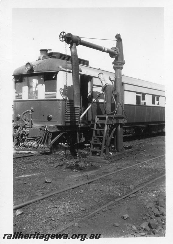P06922
ASA class 445 steam railcar, water column, East Perth Loco depot, ASA being hosed down by worker
