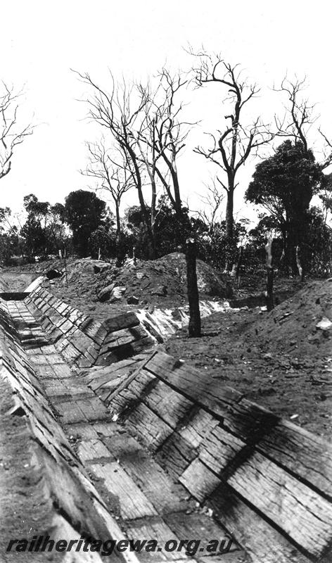 P07340
4 of 15 views of the construction of the railway dam at Williams, BN line, looking along sleeper lined drain
