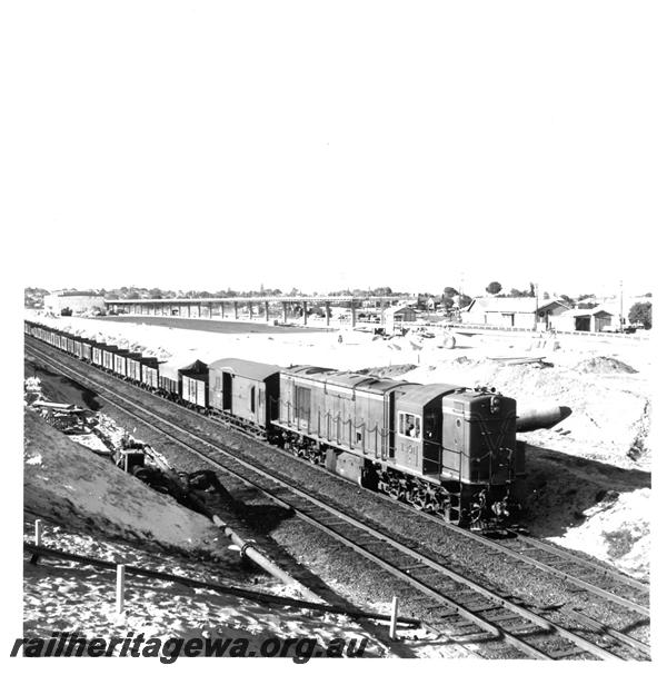 P07365
R class 1901, passing East Perth Terminal under construction with goods train
