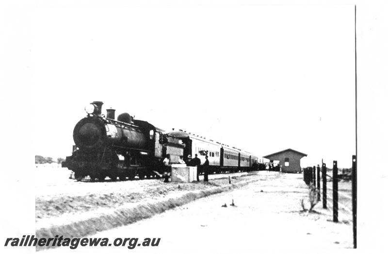 P07664
L class 4-6-2 steam loco, station building, passenger train, Big Bell, NR line. Front and side view. Same as P10289
