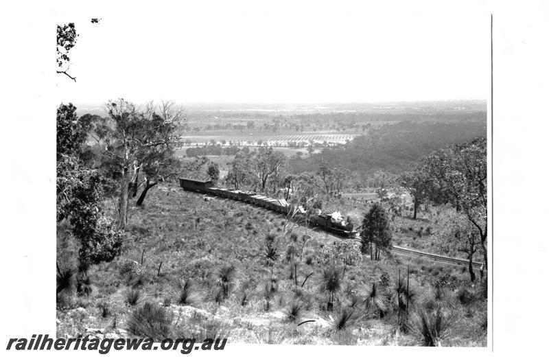 P07684
Mixed train with timber load with carriage attached, Zig Zag, UDRR line, view over coastal plain
