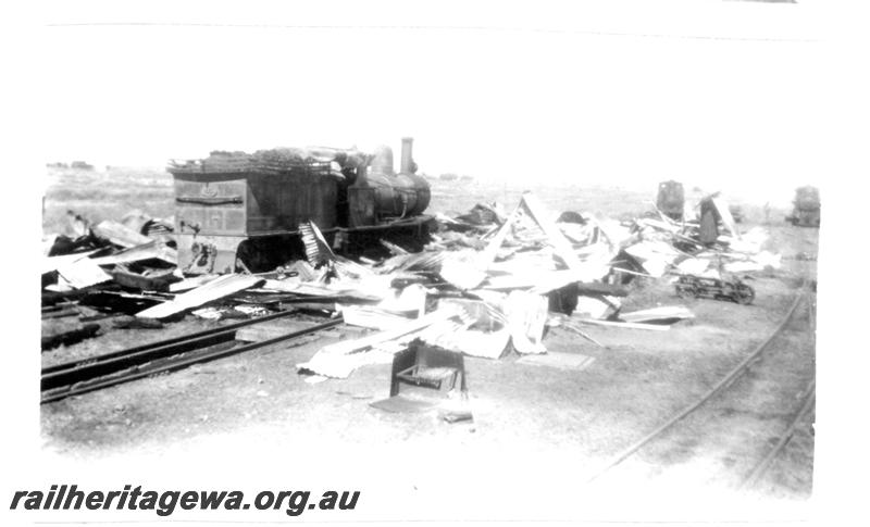 P07716
2 of 8 views of the burnt down running shed at Port Hedland, PM line on 9.10.1950, the night before the annual visit by the Chief Boiler inspector (Jack Farr), accompanied by a fitter (Ted Bosworth) and a boiler maker. G class 234 was badly damaged in fire. Similar view to P7715
