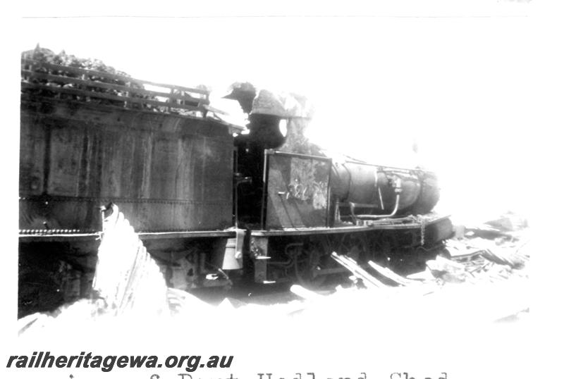P07721
7 of 8 views of the burnt down running shed at Port Hedland, PM line on 9.10.1950, the night before the annual visit by the Chief Boiler inspector (Jack Farr), accompanied by a fitter (Ted Bosworth) and a boiler maker. G class 234 was badly damaged in the fire. view of G class 234 from rear looking to front of loco

