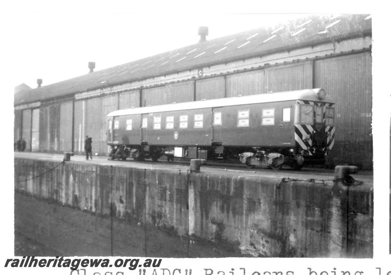 P07742
1 of 4 views of ADG class railcar on docks at Liverpool, UK being loaded on to ship
